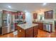 Kitchen features an island, stainless steel appliances, and granite countertops at 1812 Sam Smith Rd, Fort Mill, SC 29708
