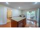 Kitchen features an island, view of the dining area, and door to the patio at 1812 Sam Smith Rd, Fort Mill, SC 29708