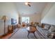 Cozy living room with plush seating, wood floors, and ample natural light at 1812 Sam Smith Rd, Fort Mill, SC 29708