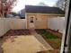 Backyard featuring a back house and a white fence at 19057 Coachmans Trce, Cornelius, NC 28031