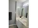 Bathroom features a double sink vanity and modern lighting at 19057 Coachmans Trce, Cornelius, NC 28031