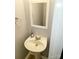 Small bathroom featuring a pedestal sink and a mirror at 19057 Coachmans Trce, Cornelius, NC 28031
