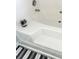 Close up of modern white bathtub with jacuzzi jets and decorative terrarium at 19057 Coachmans Trce, Cornelius, NC 28031