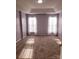 Spacious bedroom with carpet flooring, bright windows, and neutral color scheme, offering a relaxing atmosphere at 19057 Coachmans Trce, Cornelius, NC 28031