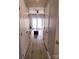 Hallway showing the home's neutral color palette, hardwood flooring, and an inviting atmosphere at 19057 Coachmans Trce, Cornelius, NC 28031