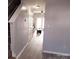 Hallway showcasing the home's neutral color palette and modern hardwood flooring at 19057 Coachmans Trce, Cornelius, NC 28031