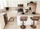 Modern kitchen with white cabinets, stainless steel appliances, and a center island with seating at 19057 Coachmans Trce, Cornelius, NC 28031