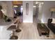 Open-concept living area with a breakfast bar, comfortable seating, and stylish decor throughout at 19057 Coachmans Trce, Cornelius, NC 28031
