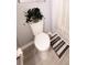 Small bathroom with toilet and wood floors and modern rug at 19057 Coachmans Trce, Cornelius, NC 28031