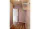 Neutral walk-in closet with ample shelving and carpeted floor at 19057 Coachmans Trce, Cornelius, NC 28031