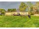 Spacious fenced backyard with a deck, trampoline, and lush green grass, perfect for outdoor activities at 2006 Kollege Ln, Crouse, NC 28033