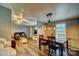 Open concept living area with hardwood floors, modern lighting and a dining area at 2006 Kollege Ln, Crouse, NC 28033
