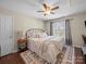 Comfortable bedroom offers a ceiling fan, natural light, and neutral color scheme at 20132 Tailwind Ln, Cornelius, NC 28031