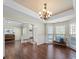 Bright dining room featuring hardwood floors and elegant chandelier lighting at 20132 Tailwind Ln, Cornelius, NC 28031