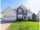 Charming two-story home featuring a well-manicured lawn and attached two-car garage at 20132 Tailwind Ln, Cornelius, NC 28031