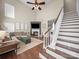 Inviting living room with fireplace, staircase and comfortable sectional seating at 20132 Tailwind Ln, Cornelius, NC 28031