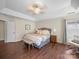 Spacious main bedroom features a tray ceiling, ceiling fan, hardwood floors, and a reading nook at 20132 Tailwind Ln, Cornelius, NC 28031