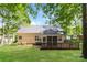 This home features a deck, screened in porch, and spacious backyard with lush landscaping at 2104 Congress Ct, Kannapolis, NC 28083