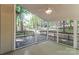 Relaxing screened-in porch with ceiling fan, offering serene views of the surrounding wooded area at 2104 Congress Ct, Kannapolis, NC 28083