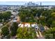Stunning aerial view featuring the home and surrounding neighborhood with city skyline in the distance at 215 Keswick Ave, Charlotte, NC 28206