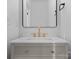 Elegant bathroom vanity with modern fixtures, a sleek mirror, and neutral color scheme at 215 Keswick Ave, Charlotte, NC 28206