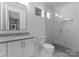 This bathroom has white cabinets, stylish finishes, and a glass walk-in shower at 215 Keswick Ave, Charlotte, NC 28206