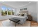 Bright bedroom with neutral tones, hardwood floors, and ample natural light at 215 Keswick Ave, Charlotte, NC 28206