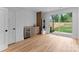 Functional bonus room featuring built-ins, a sink, and access to the backyard at 215 Keswick Ave, Charlotte, NC 28206