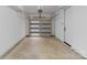 Two car garage with white walls, concrete floors, and bright lighting at 215 Keswick Ave, Charlotte, NC 28206