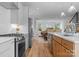 Modern kitchen with stainless steel appliances, open floor plan, and hardwood flooring at 215 Keswick Ave, Charlotte, NC 28206