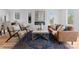 This cozy living room is full of natural light and features a modern fireplace at 215 Keswick Ave, Charlotte, NC 28206