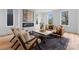 Bright living room features a modern fireplace, stylish furnishings, and lots of natural light from large windows at 215 Keswick Ave, Charlotte, NC 28206
