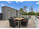 Outdoor patio with dining table and chairs for relaxing at 215 Keswick Ave, Charlotte, NC 28206