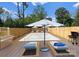 Enjoy the summer months in your private pool with in-pool loungers and an umbrella at 215 Keswick Ave, Charlotte, NC 28206