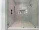 Modern walk-in shower with stylish tile, built-in niche, and high-end fixtures provides a luxurious experience at 215 Keswick Ave, Charlotte, NC 28206