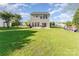 This back yard features a large lawn and access to the house through sliding glass doors at 2409 Deberry Ct, Charlotte, NC 28213