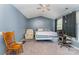 Spacious bedroom features carpet, a ceiling fan, two windows, and room to relax at 2409 Deberry Ct, Charlotte, NC 28213