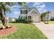 Charming two-story home with manicured lawn, attached garage, and mature landscaping at 2409 Deberry Ct, Charlotte, NC 28213