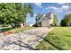 Well-maintained two-story home with a long driveway and mature trees at 2409 Deberry Ct, Charlotte, NC 28213
