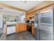 Bright kitchen with stainless steel appliances and a convenient passthrough to the adjacent living area at 2409 Deberry Ct, Charlotte, NC 28213