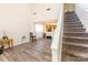 Light and bright living room with a staircase and modern flooring at 2409 Deberry Ct, Charlotte, NC 28213