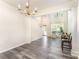 Open-concept living room boasts tall ceilings, large windows, and ample natural light at 2409 Deberry Ct, Charlotte, NC 28213