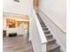 Open-concept view of staircase and living area with modern flooring at 2409 Deberry Ct, Charlotte, NC 28213