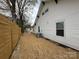 View of the backyard with the house and the AC unit at 312 W Henderson St, Salisbury, NC 28144