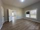 Bright bedroom with wood-look floors, featuring a view into a connected room at 312 W Henderson St, Salisbury, NC 28144