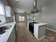 Modern kitchen featuring an island cooktop and sleek stainless-steel appliances at 312 W Henderson St, Salisbury, NC 28144
