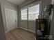 Well lit laundry area includes a water heater, wood-look floors and dual windows at 312 W Henderson St, Salisbury, NC 28144