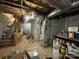 Unfinished basement with exposed ductwork and a furnace, offering potential for customization at 3452 Odell School Rd, Concord, NC 28027