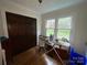 Bedroom with natural light, hardwood floors, and built in wardrobe at 3452 Odell School Rd, Concord, NC 28027