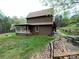 Charming house with a covered porch and well-maintained lawn, providing a serene outdoor space at 3452 Odell School Rd, Concord, NC 28027